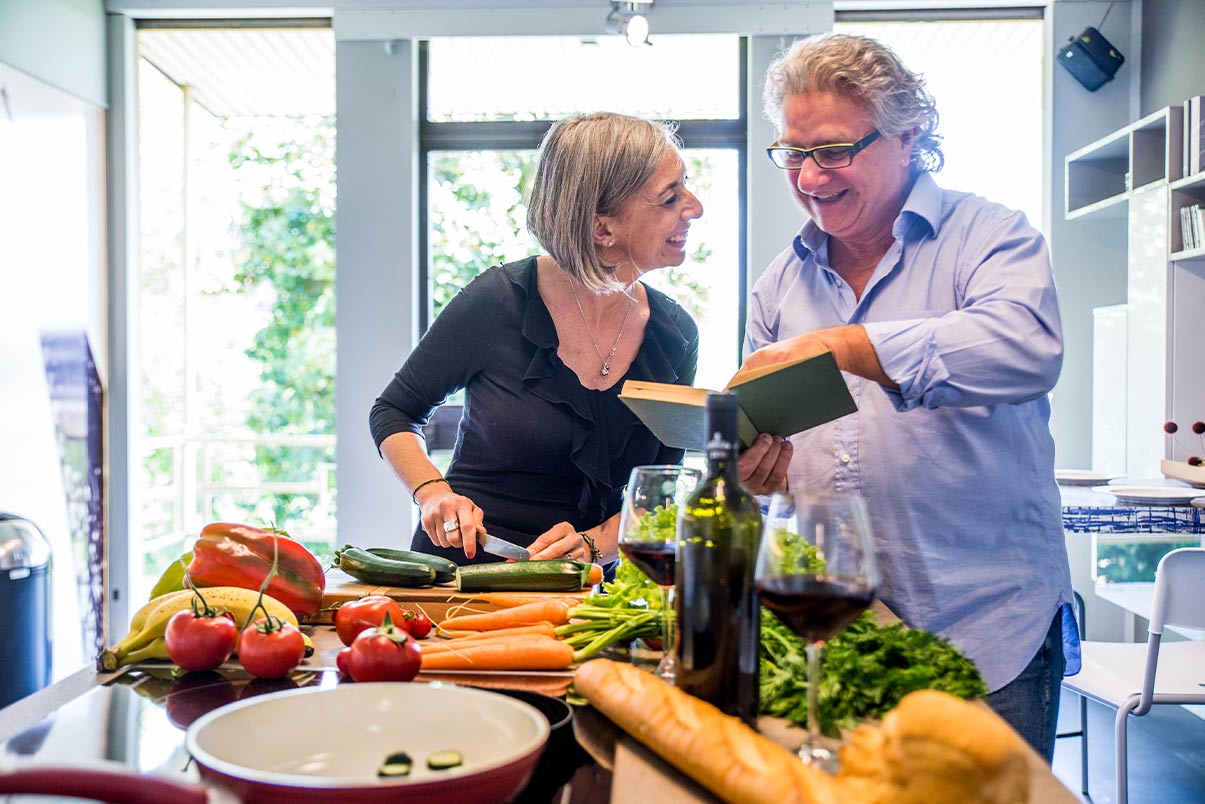 couple preparing recipe in the kitchen what is an iul policy skokie il