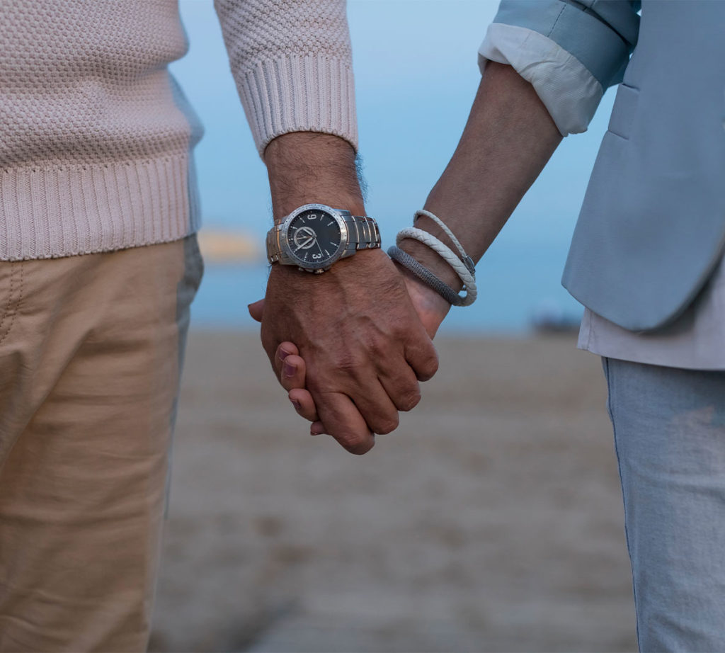 close up of seniors holding hands on beach annuity income chicag il