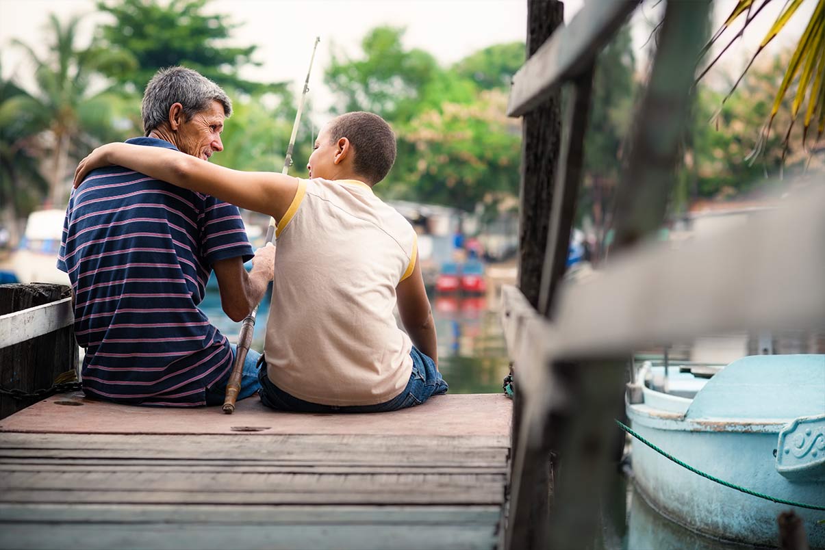 grandpa and grandson sitting at the end of a dock fishing together what is an annuity chicago il