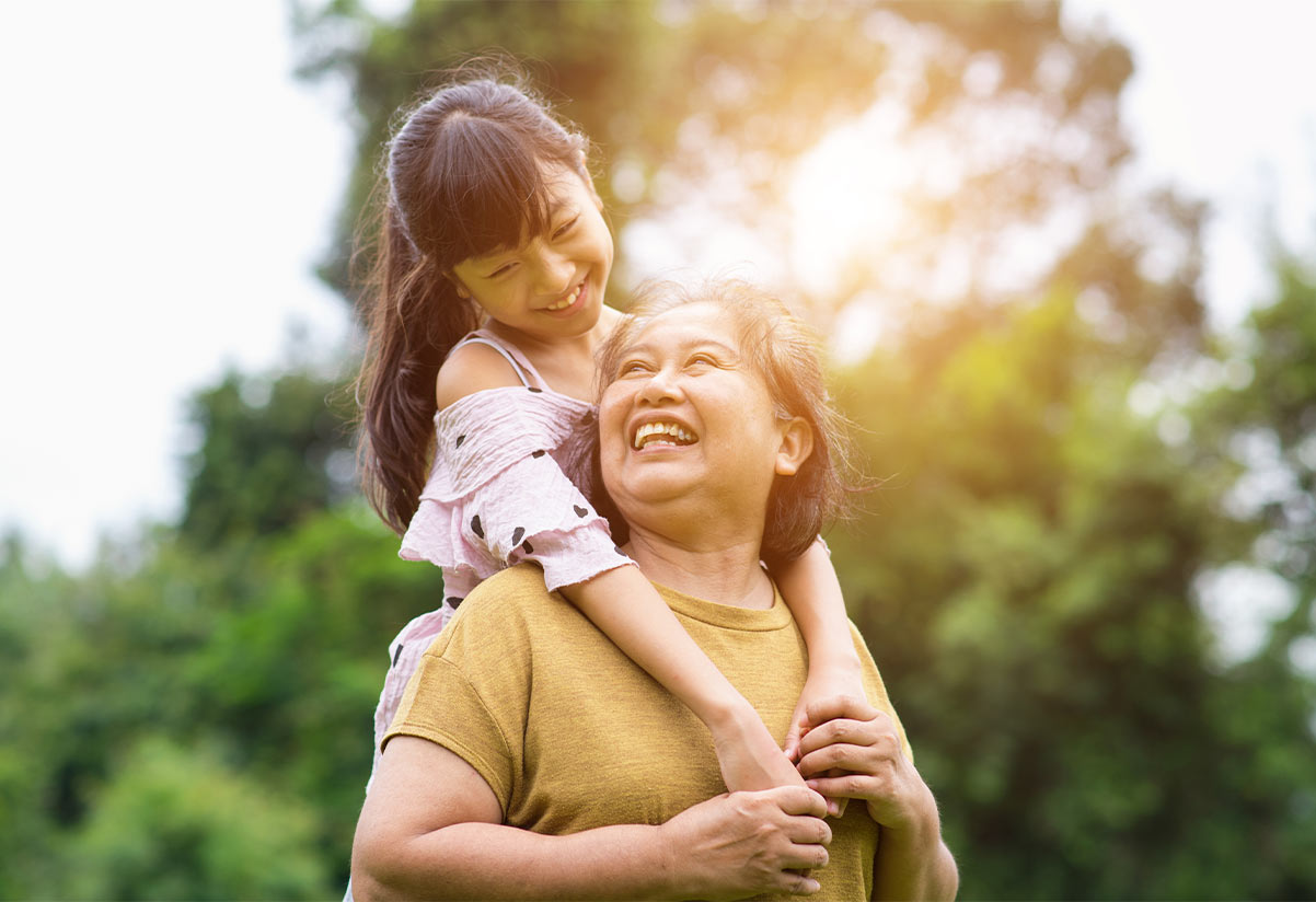 sweet portrait of granddaughter on her grandmothers back what is an iul policy skokie il